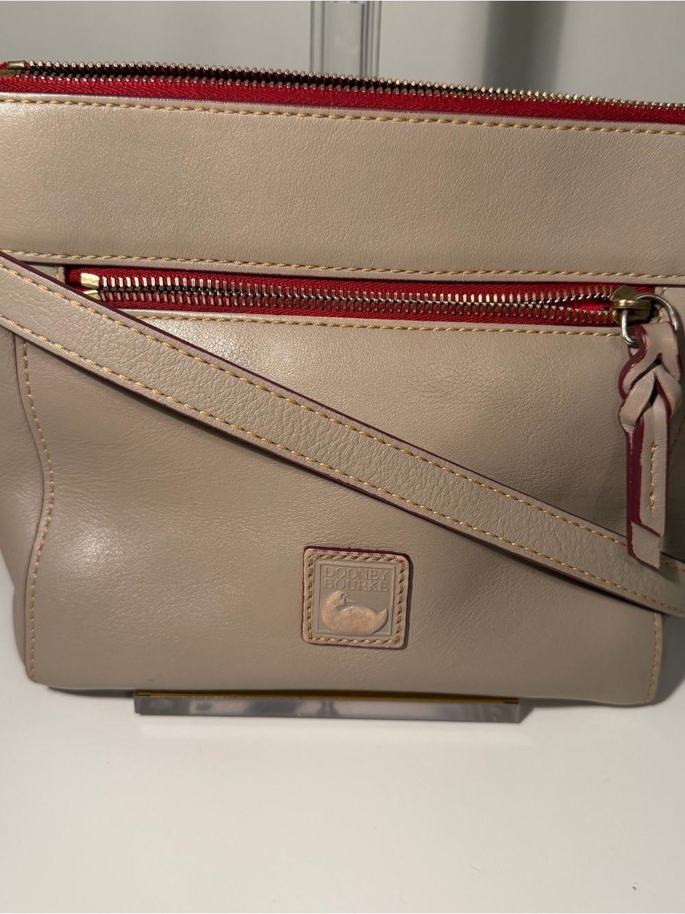 Dooney & Bourke Light Taupe Florentine Vacchetta Leather Crossbody with Red Trim